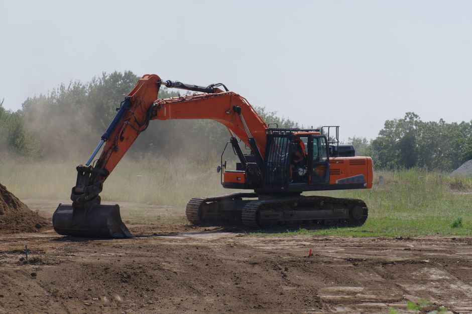 Excavator digging on a job site